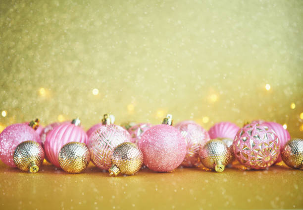 istock Glittering Christmas Background with Pink and Gold Decorations 1285867190