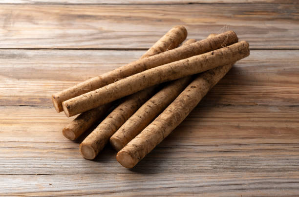 A burdock placed against a background of wooden boards