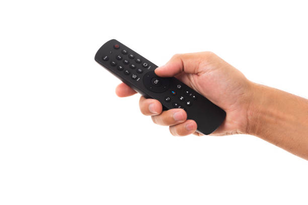 istock Hand holding television and audio remote control 1285869148