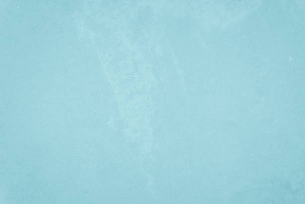 istock Pastel Blue and White concrete stone texture for background in summer wallpaper decor. Cement and sand wall of tone vintage. Concrete abstract light cyan color, cement texture mint green for design. 1285870826