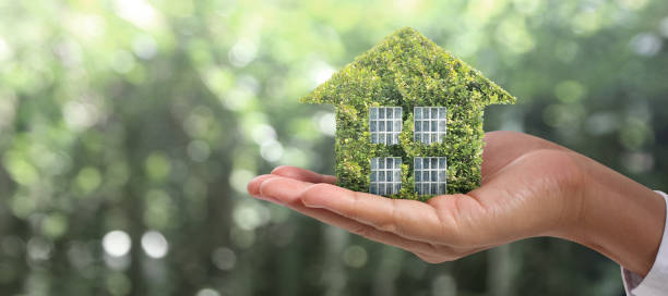 istock House Residential Structure in hand ,business home idea 1285876192