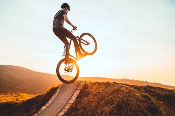 istock Young man on a mountain bike performing a dirt jump 1285880922