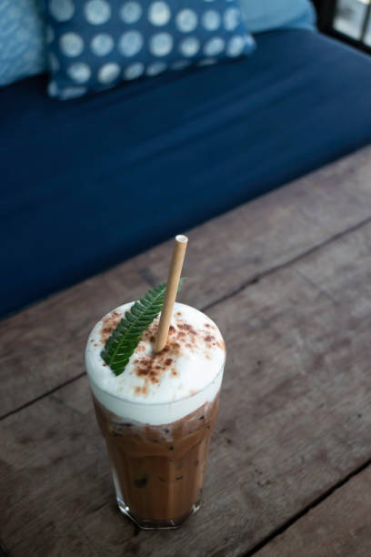 istock Coffee glass decorated with fern leaf 1285881043