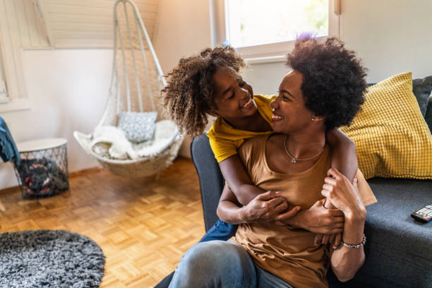 istock Mother and daughter embracing at home. 1285881930