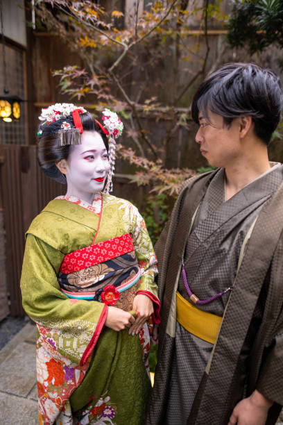 'Maiko' (Geisha in training) and young man looking at each other