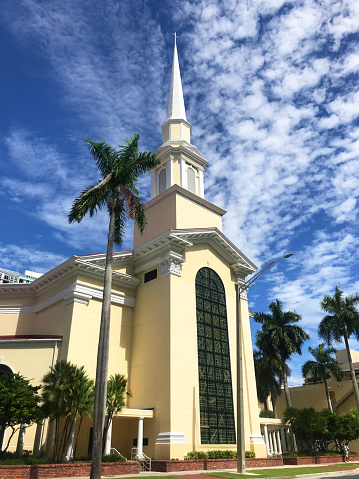 A general landscape view of a church in Fort Lauderdale at Midday in a summer season, no people at the streets during the Corona Virus Pandemic illness breakdown.