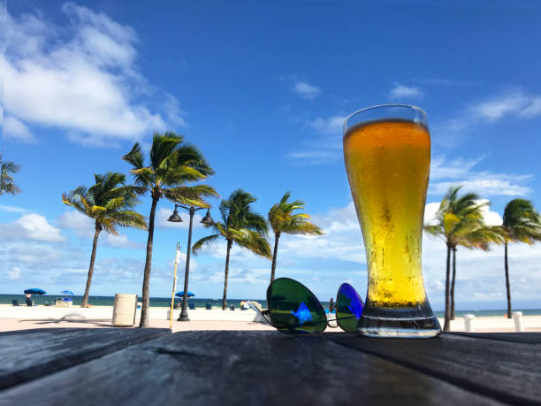 istock Ice cold beers under the palm tree on the tropical beach 1285883669
