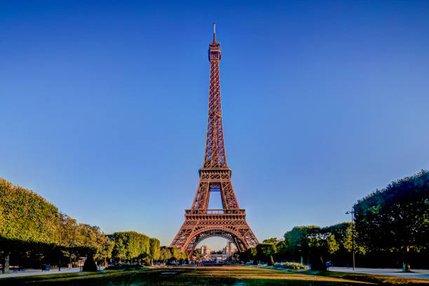 istock Architectural details of the Eiffel Tower at sunrise against a clear blue sky 1285885978