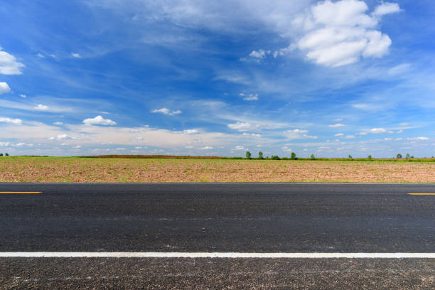 istock Side view of asphalt road and beautiful blue sky. 1285888802