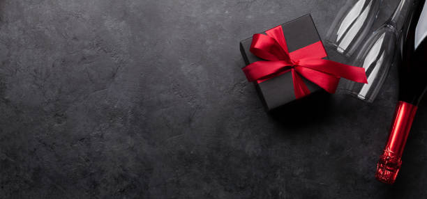 istock Valentines or Christmas card with champagne and gift 1285889485