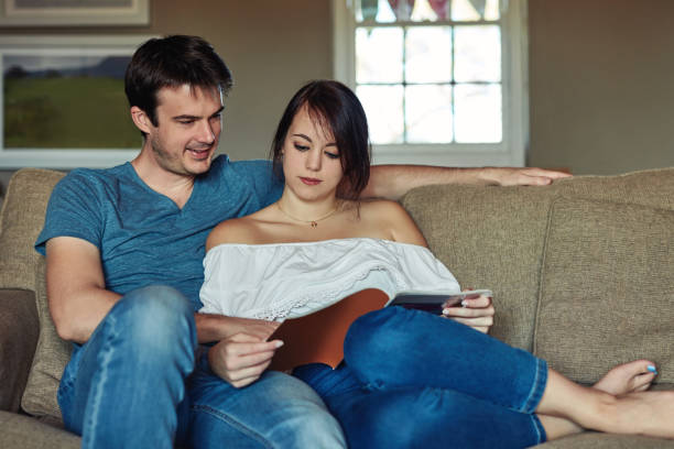 istock Paging through their favourite magazine 1285889577