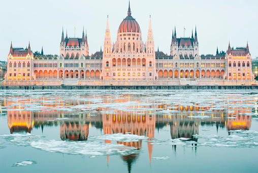 Hungarian parliament building at winter, ice drift on Danube river (Budapest)