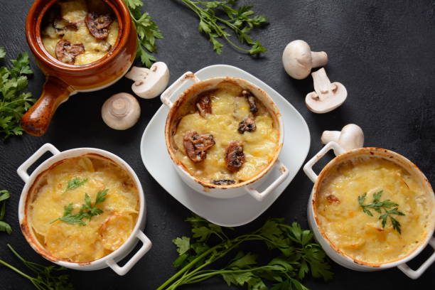 istock Potato gratin with mushrooms in baking cocottes 1285890557