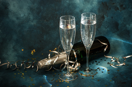 Christmas and New Year celebration with champagne. New Year holiday concept. Two Champagne glasses and bottle