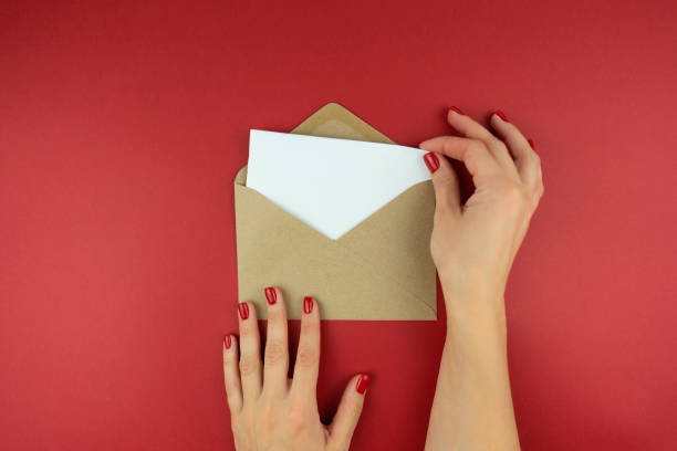 istock A woman holds a letter in an envelope in her hands 1285894251