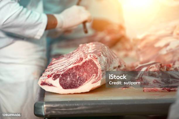 Butcher Cutting Wagyu Beef In The Slaughterhouse Stock Photo - Download Image Now - Meat Packing Industry, Meat, Butcher's Shop