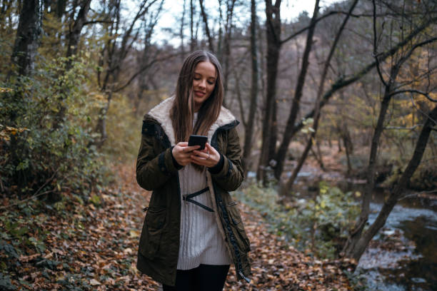 istock Young girl in the autumn walk 1285896123