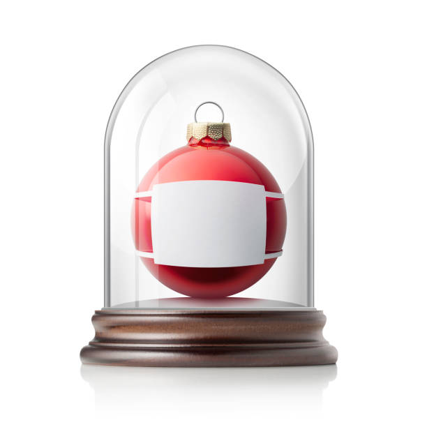 christmas and covid-19. christmas ball with medical mask in glass bell jar. - christmas decoration campanula decoration christmas imagens e fotografias de stock