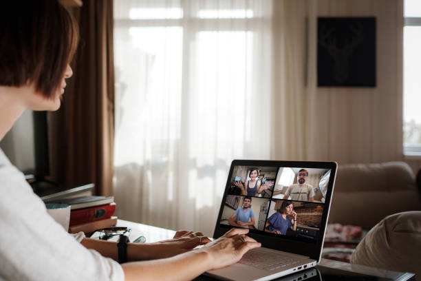 istock Smiling young asian woman video calling on laptop. 1285896471