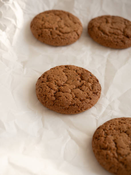 istock Oatmeal cookies on white background in morning light 1285899899