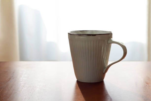 istock A hot drink with hot, steaming coffee placed on a sunny table 1285900217