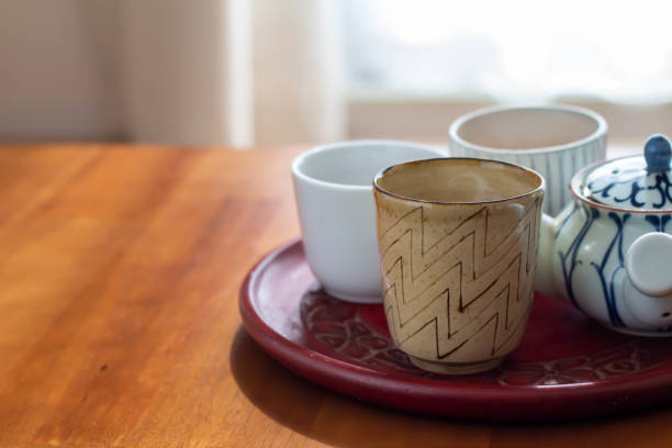 istock A hot water drink with a kyusu placed on a sunny table and warm roasted green tea 1285900256