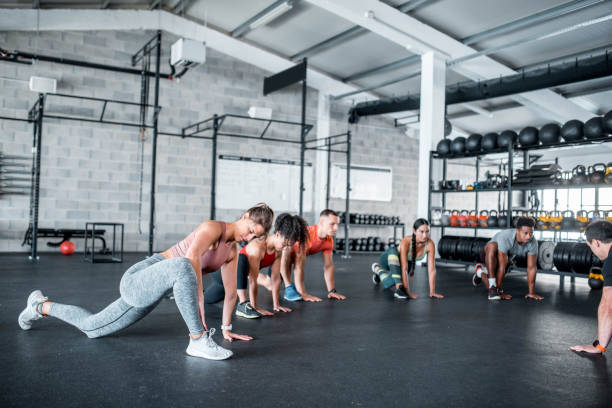 istock Group Of Athletes Stretching In The Gym 1285901364