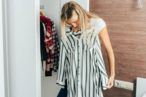 istock Woman in wardrobe chooses clothes 1285901710