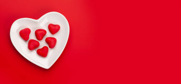 istock Heart shaped candies. Valentines day card 1285902080