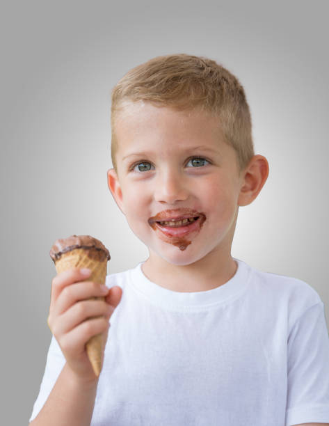 istock Happy kid boy ready for eating chocolate ice cream 1285903085