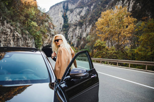 istock Businesswoman entering in car 1285903221