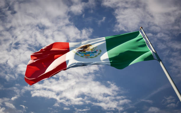 istock Mexico national flag waving at sky background close-up. 1285907181