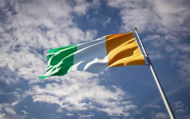 istock Cote dVoire national flag waving at sky background close-up. 1285908038