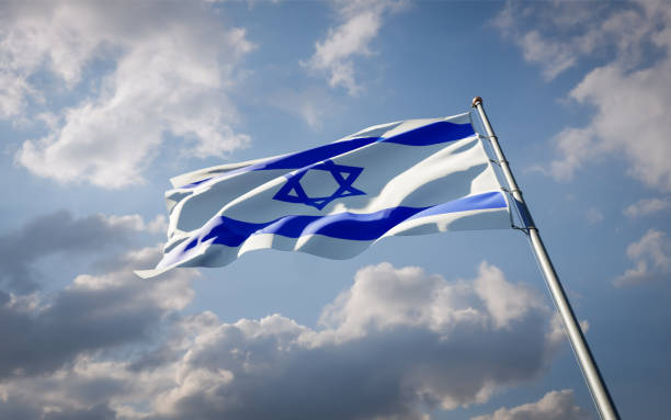 istock Israel national flag waving at sky background close-up. 1285908129