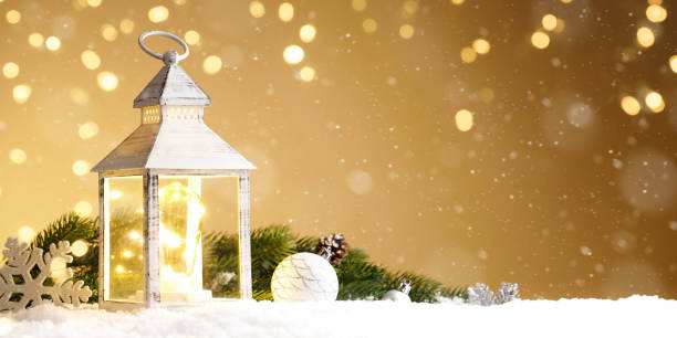 istock Burning lantern with christmas decoration in the snow 1285908534