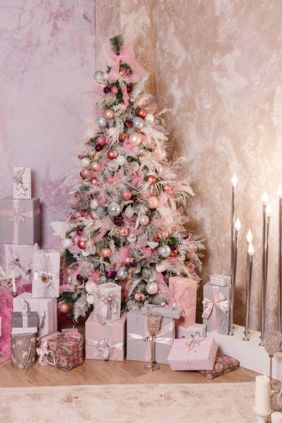 istock beautiful Christmas tree in gently pink style 1285910982
