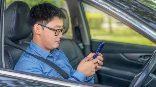 istock Young asian man texting on the phone. 1285912068