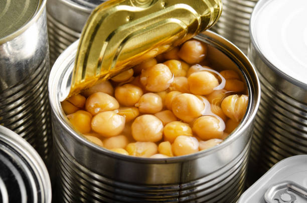 istock Canned chickpeas in just opened tin can. Non-perishable food 1285912279