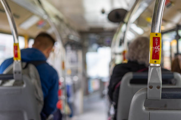 istock Bus interior in circulation with the STOP button in the foreground on a blurred background. 1285913287