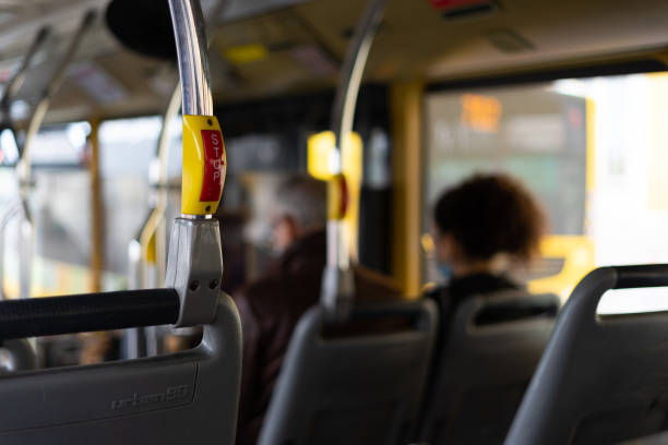 istock Bus interior in circulation with the STOP button in the foreground on a blurred background. 1285913364