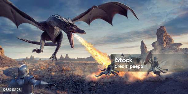 Fire Breathing Dragon Flying Low And Attacking Knights In Desert Stock Photo - Download Image Now