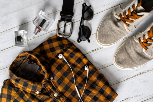 istock Men's casual outfits on wood board background, essential leisure items for the programmer 1285913437