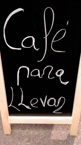 istock Coffee to take away. Cafeteria advertisement handwritten with chalk on blackboard. 1285914458