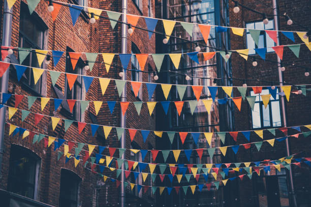 istock Bunting flags hanging in the courtyard between houses. 1285914650