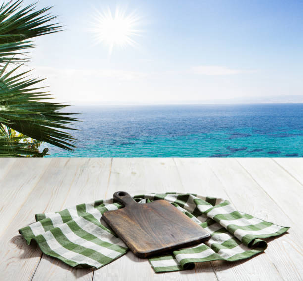 istock Table cloth on wooden deck table with napkin. Kitchen background. 1285915241