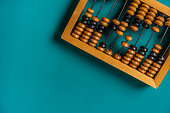 Top view of vintage abacus on a green background, the concept of mathematical calculations