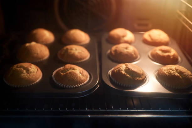 istock Group of cupcakes inside the oven 1285915982