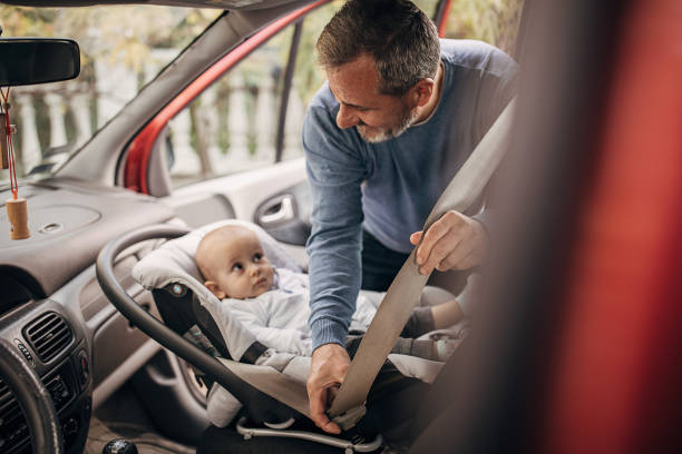 istock Grandfather and grandson use seat belts 1285916291