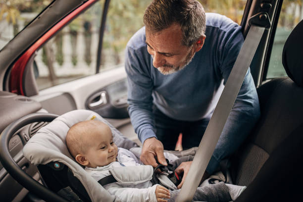 istock Grandfather and grandson use seat belts 1285916532