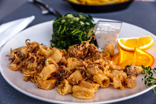 golden fried calamari ring with side spinach